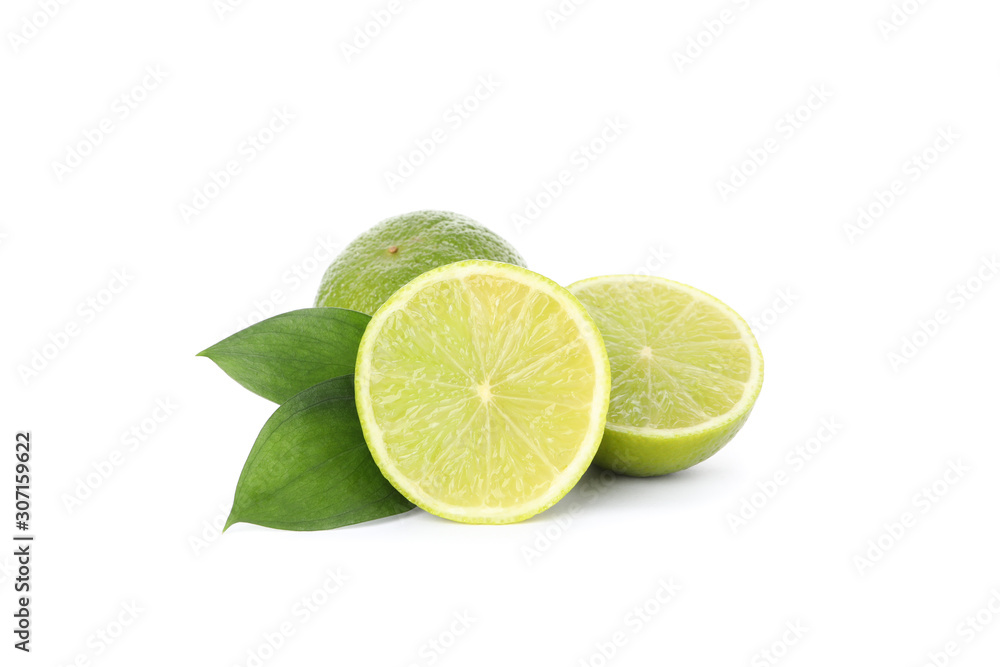 Limes with leaves isolated on white background. Juicy fruits Limes with leaves isolated on white background. Juicy fruits