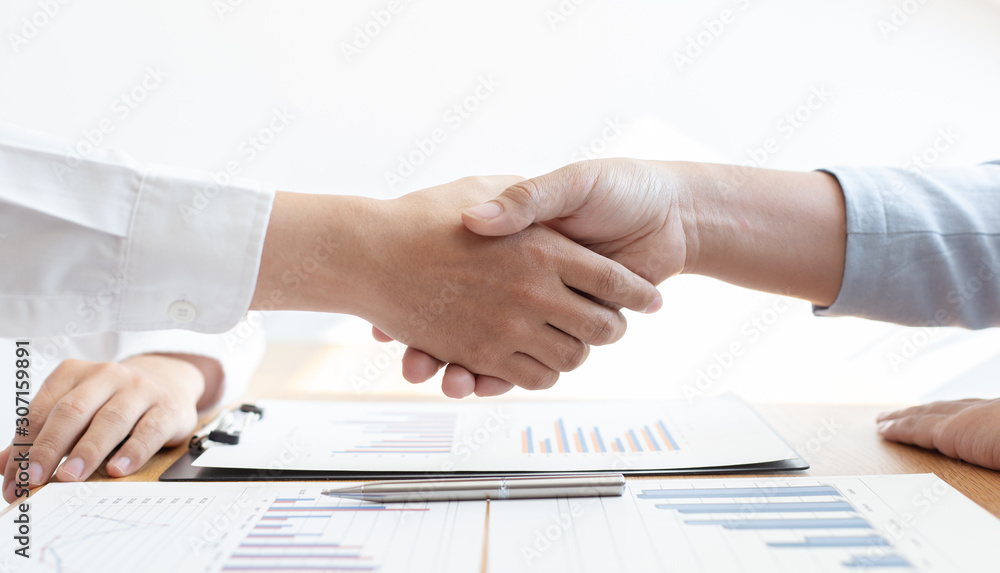 Successful ,The image of business women and men shake hands, Shaking hand concept.