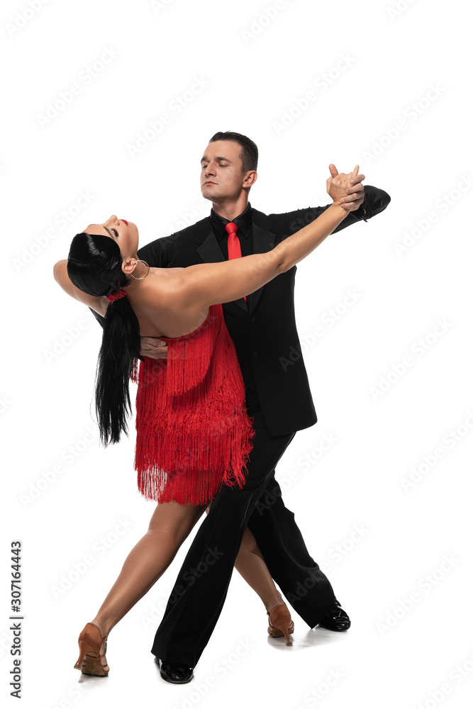 handsome, elegant dancer leading attractive partner while performing tango on white background handsome, elegant dancer leading attractive partner while performing tango on white background
