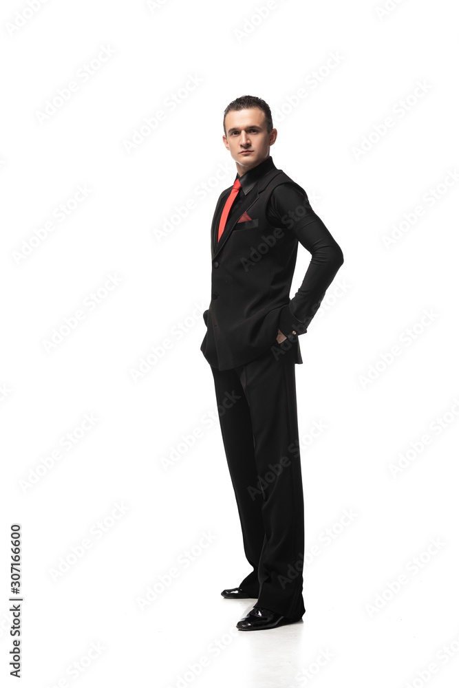 elegant, confident tango dancer looking at camera while standing with hands in pockets on white background elegant, confident tango dancer looking at camera while standing with hands in pockets on white background