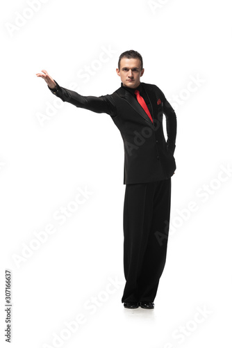 stylish, sensual tango dancer looking at camera while inviting to dance on white background