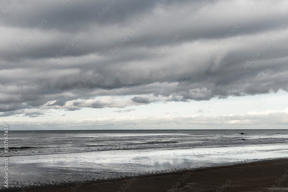 Oostduinkerke, Belgium: The North Sea with dramatic clouds Oostduinkerke, Belgium: The North Sea with dramatic clouds