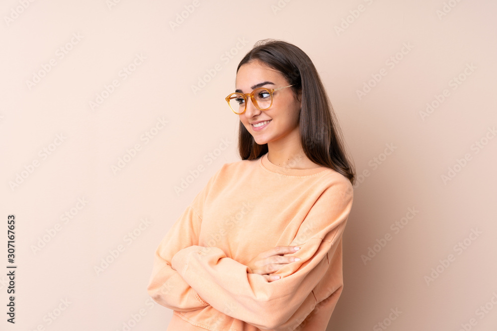 Young girl over isolated background looking to the side Young girl over isolated background looking to the side