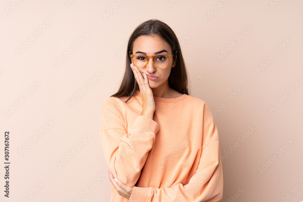 Young girl over isolated background unhappy and frustrated Young girl over isolated background unhappy and frustrated