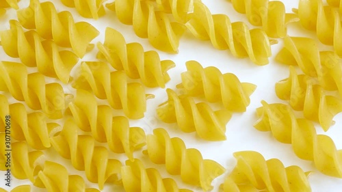 Spiral pasta in a circular motion. closed