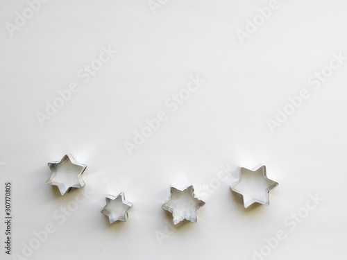 stainless steel molds for baking christmas cookies. Stars  isolated on white background