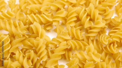 Spiral pasta in a circular motion. closed