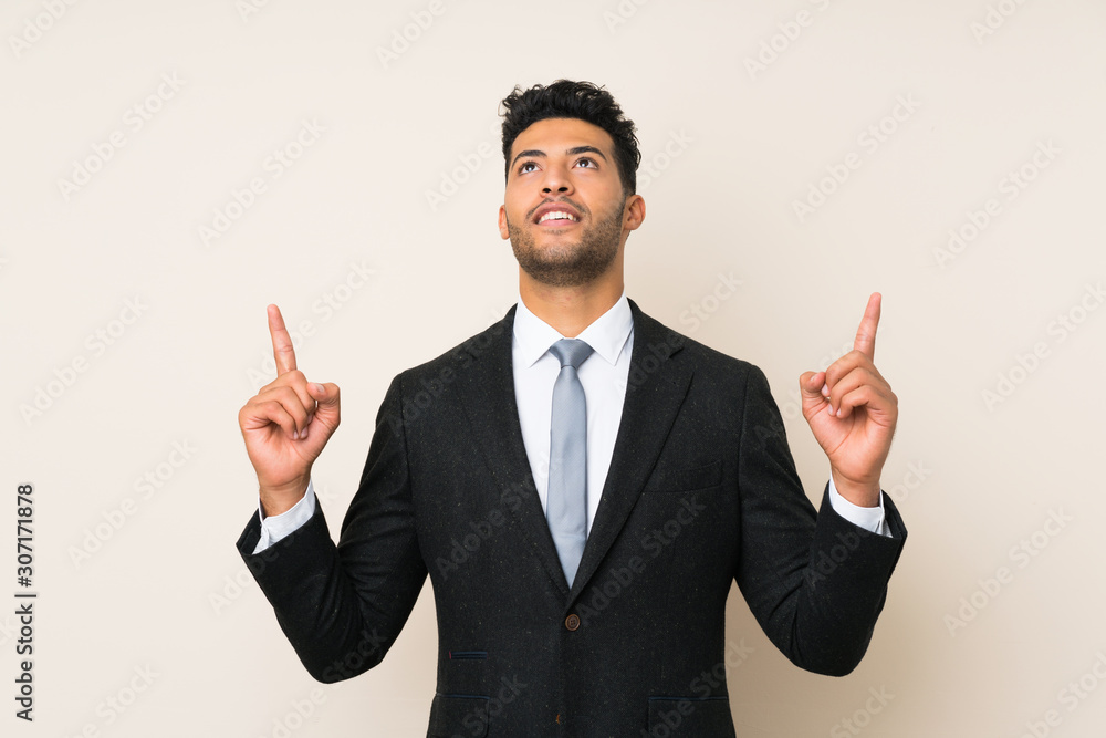 Young handsome businessman man over isolated background pointing with the index finger a great idea Young handsome businessman man over isolated background pointing with the index finger a great idea