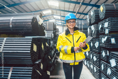 Logistics for building materials - woman working in warehouse