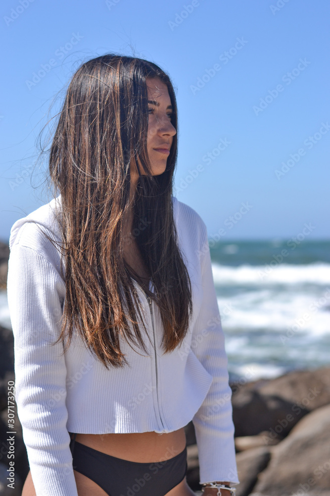 Young woman portrait at the sea side, summer time