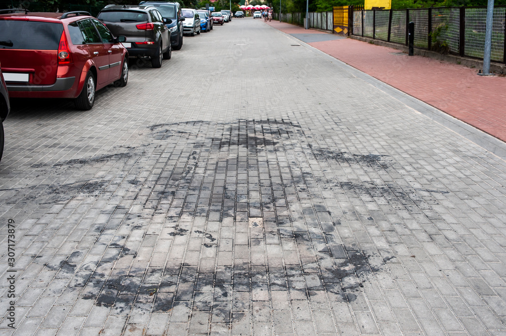 Sidewalk contaminated beacuse of burnt car