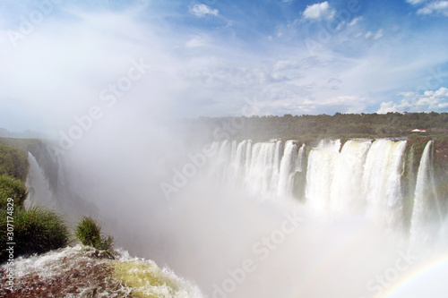 View of Devil s Throat With Rainbow Against Blue Sky and At Iguazu Falls  Argentina