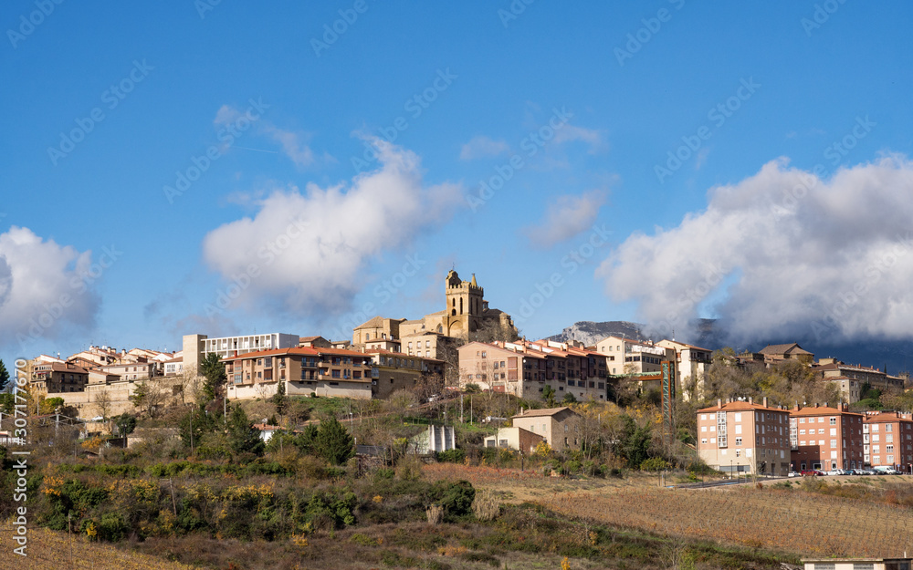 Village landscape topped by stone bell tower in Laguardia, Spain