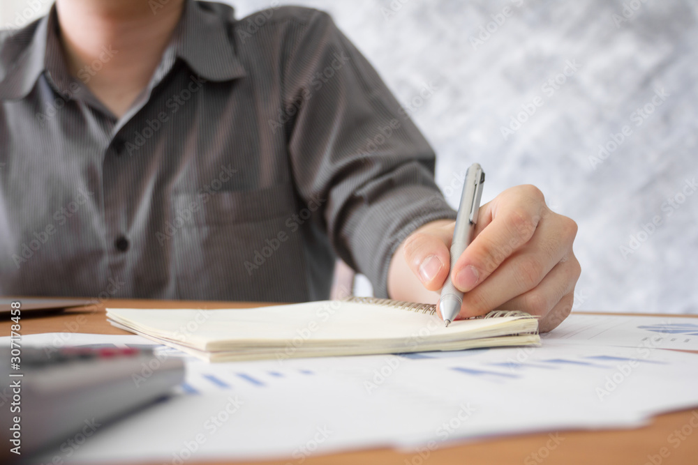 business man working to analyze graph chart information diagram document on office desk business man working to analyze graph chart information diagram document on office desk