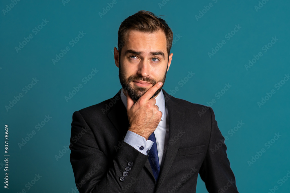 Positive thinking businessman looking up and around on blue background. Happy face expressions. Handsome male model in campaign suit. Positive thinking businessman looking up and around on blue background. Happy face expressions. Handsome male model in campaign suit.