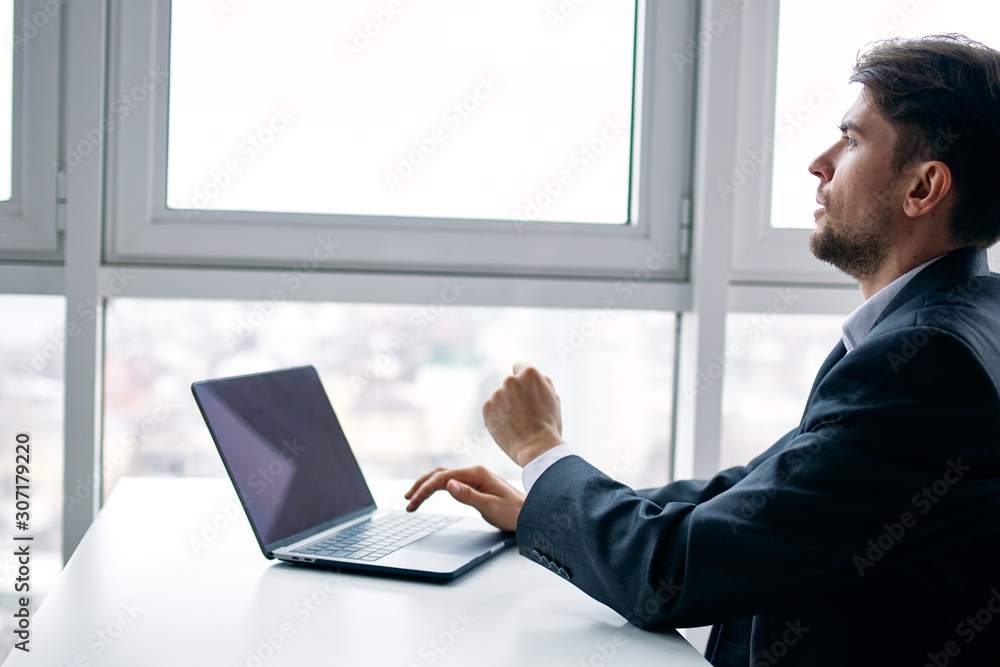 businessman working on his laptop in office businessman working on his laptop in office