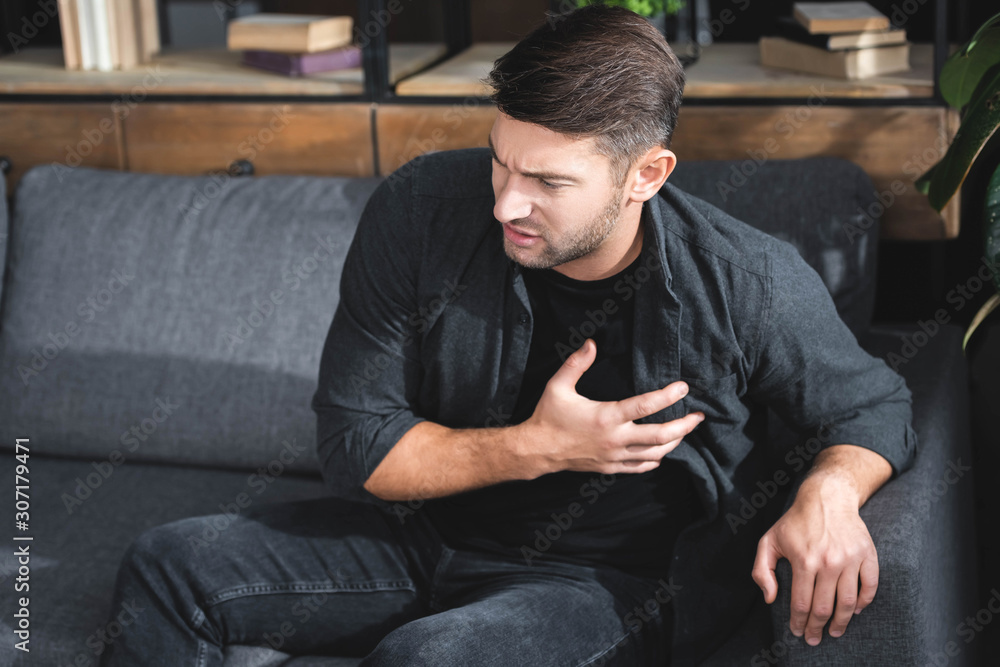 handsome man in shirt having heart attack in apartment handsome man in shirt having heart attack in apartment