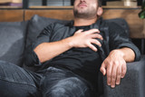 selective focus of man with having heart attack in apartment