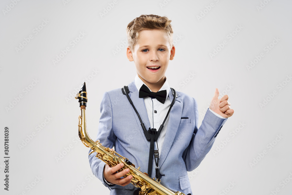 Fototapeta premium boy with saxophone