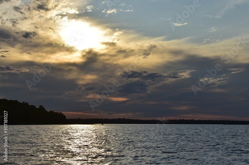 Cloudy sky sunset over lake © T. Schmidt