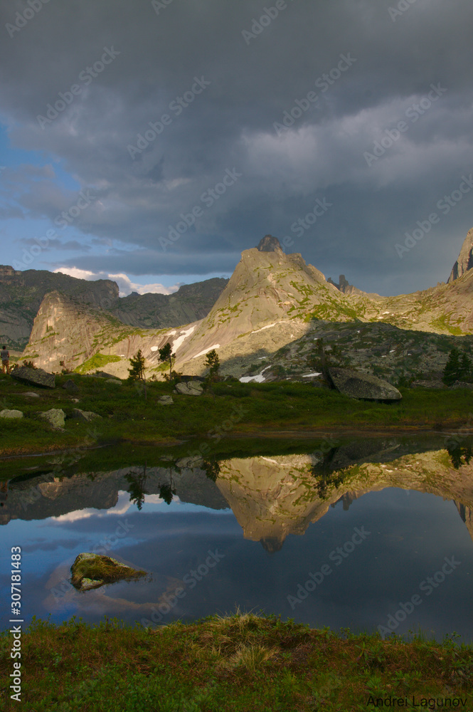 Reflection of a mountain peak in a mountain lake