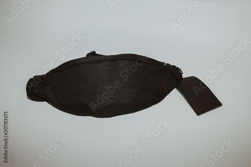 Fényképezés Black waist bag isolated on white background.