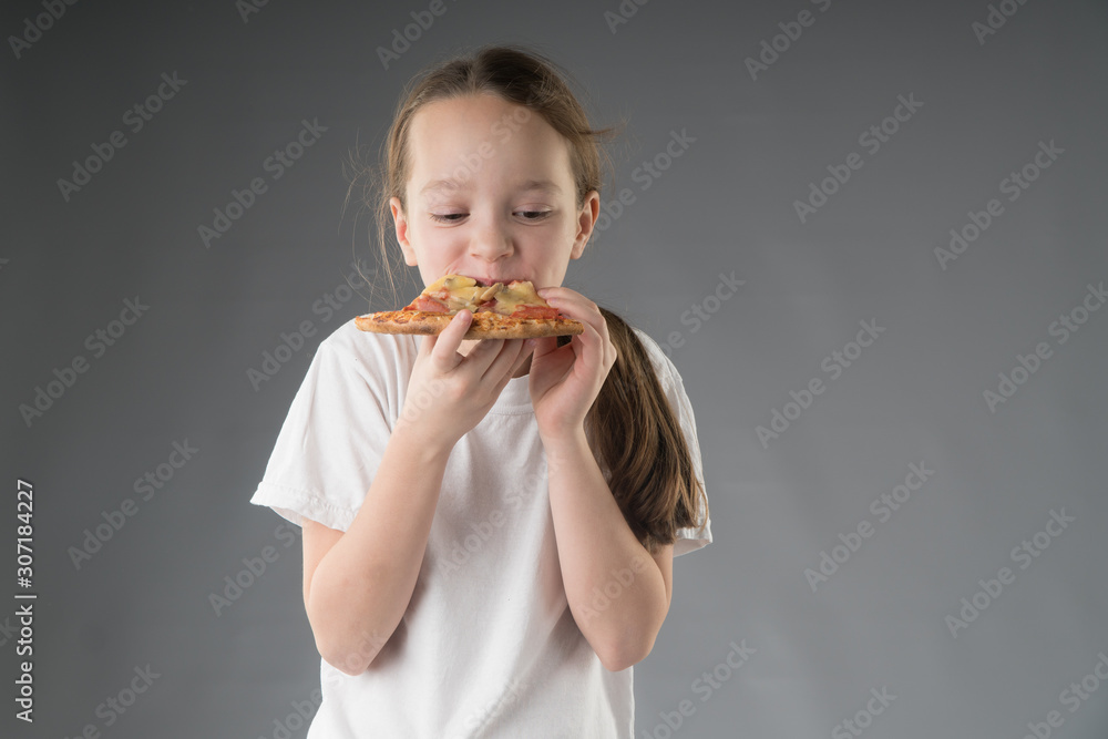 the child is eating pizza. the child is eating pizza.