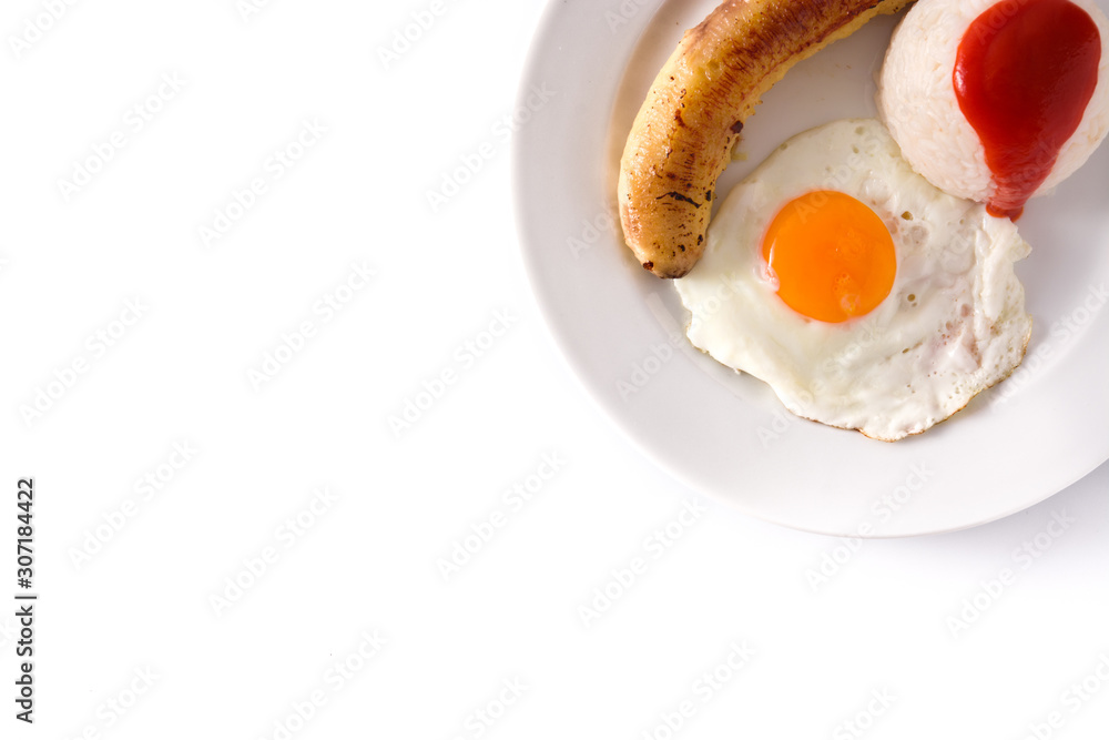 Arroz a la cubana.Typical Cuban rice with fried banana and fried egg on a plate isolated on white background. Top view Arroz a la cubana.Typical Cuban rice with fried banana and fried egg on a plate isolated on white background. Top view