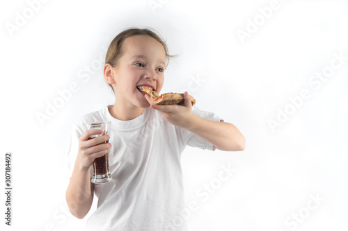  young girl eating pizza and drinking an ice drink