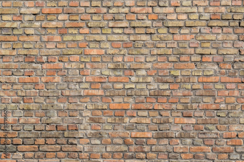 Brick wall with old vintage bricks background or texture.