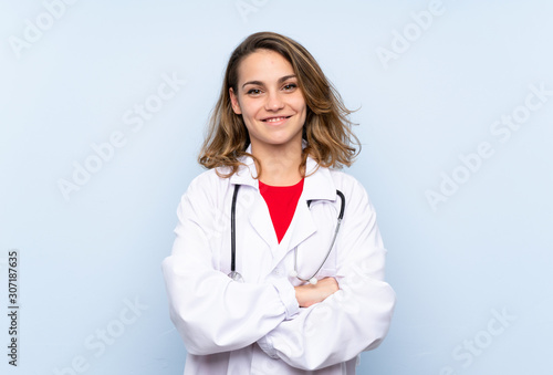 Young blonde woman with doctor gown