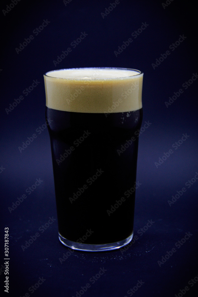 Black beer on black background Black beer on black background