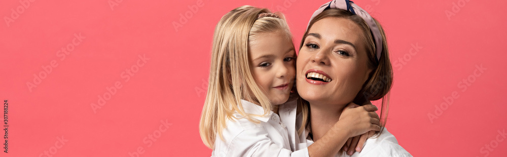 panoramic shot of daughter hugging smiling mother isolated on pink panoramic shot of daughter hugging smiling mother isolated on pink