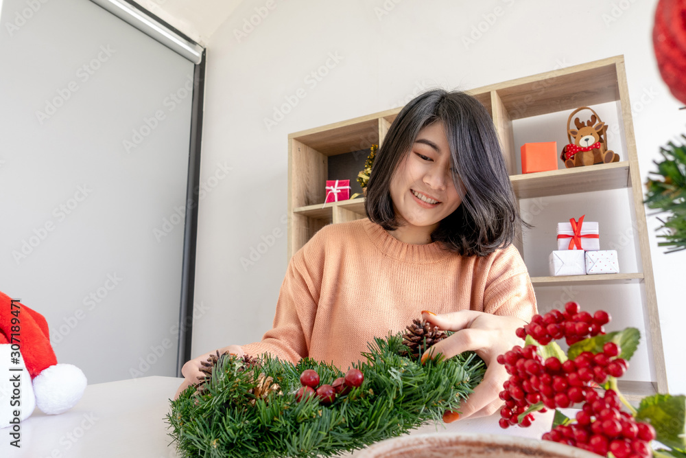 young asian woman prepare decorating for christmas or new year celebration young asian woman prepare decorating for christmas or new year celebration