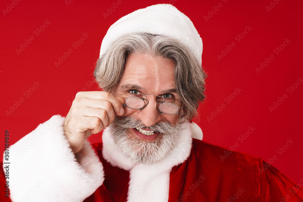 Image of gray-haired old Santa Claus man in spectacles and holiday costume Image of gray-haired old Santa Claus man in spectacles and holiday costume