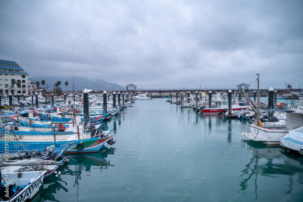 The Fishing Boats parking at Fisherman's wharf tamsui,waterfront area is popular travel destination on tamsui, Taipei, Taiwan.