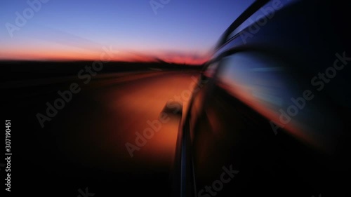Driving in night highway, blurred timelapse. View from outside car cabin
