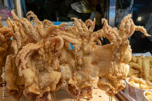 Crispy fried giant squids on stick.