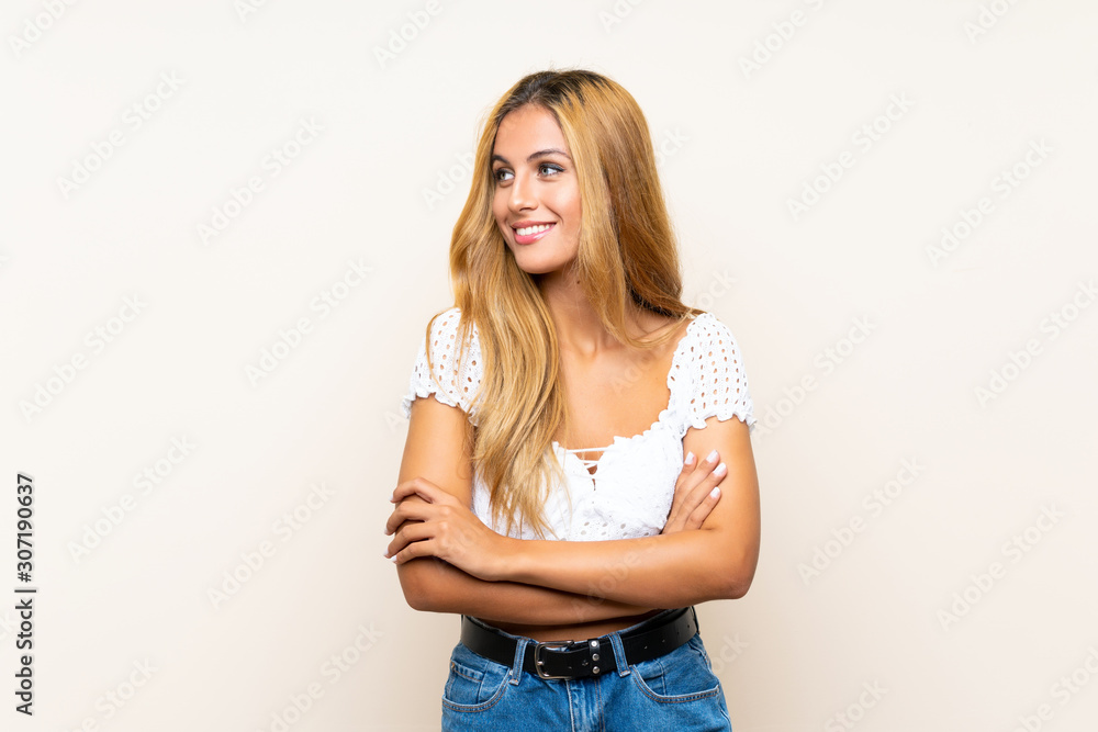 Young blonde woman over isolated background laughing Young blonde woman over isolated background laughing