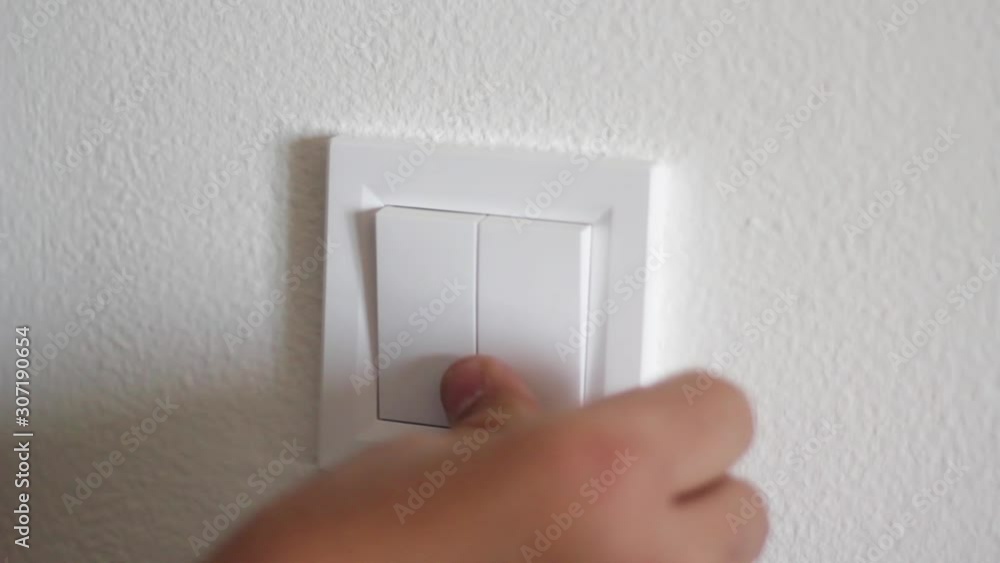 Electrician fixing the light switch Electrician fixing the light switch