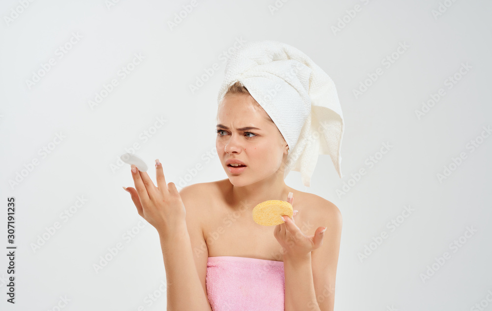 portrait of young woman with towel on her head portrait of young woman with towel on her head