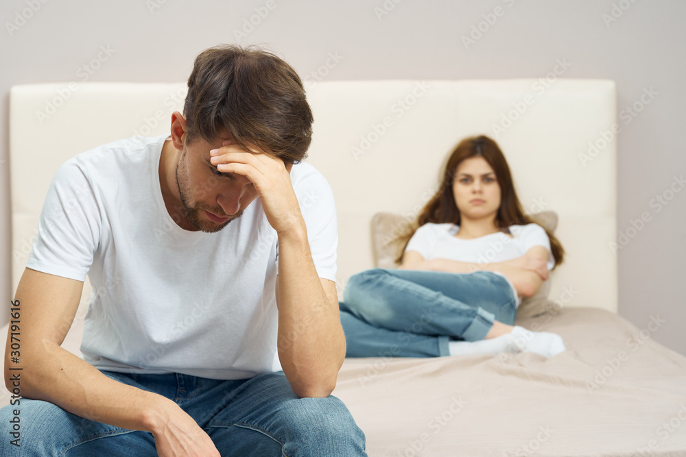 young couple sitting on sofa at home young couple sitting on sofa at home