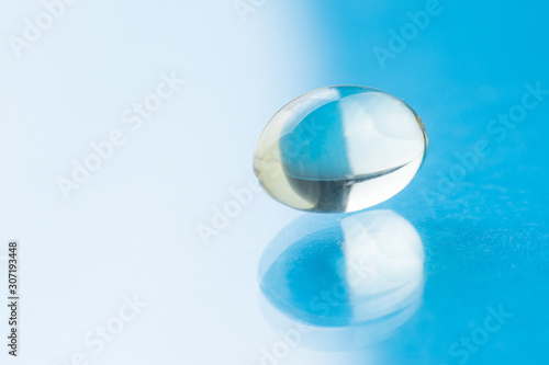 Transparent tablet on a blue background  close up
