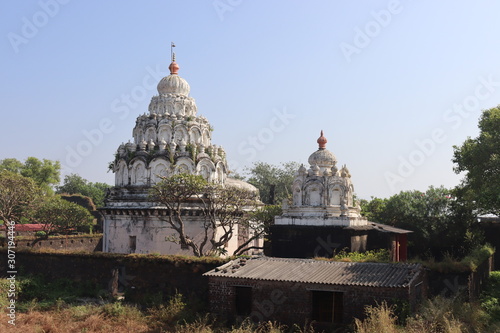 Scenic view of temples. White colored decorated dome of an ancient pagoda.