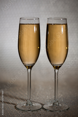 Drink. Two glasses white wine, light background