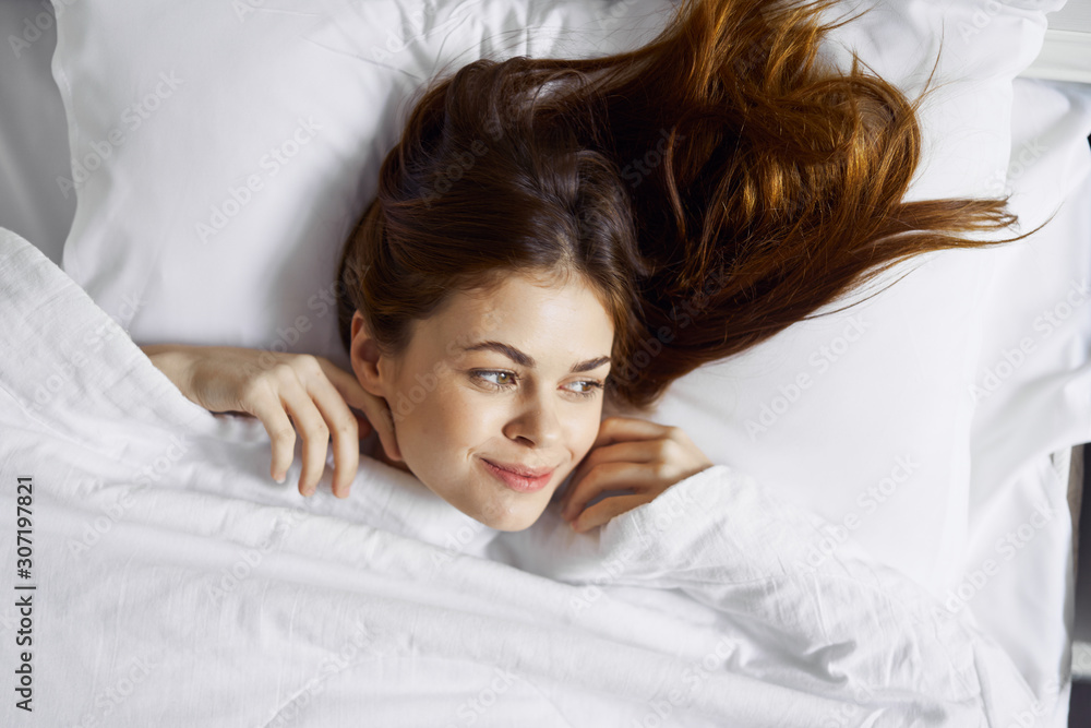 portrait of a woman lying on her bed portrait of a woman lying on her bed