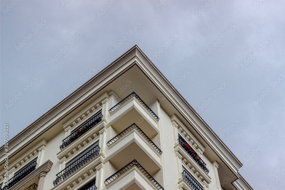 Bottom-up shoot of classical ecclectic style of mass housing with iron details Bottom-up shoot of classical ecclectic style of mass housing with iron details