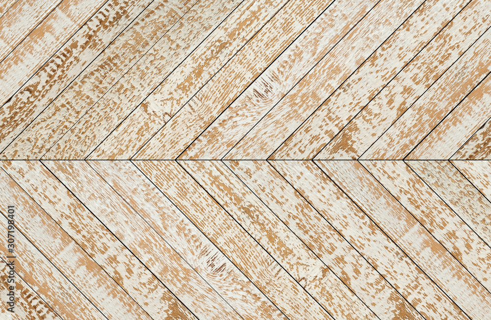 Artificially aged parquet floor with herringbone pattern. Wooden wall of worn white painted boards. Artificially aged parquet floor with herringbone pattern. Wooden wall of worn white painted boards.