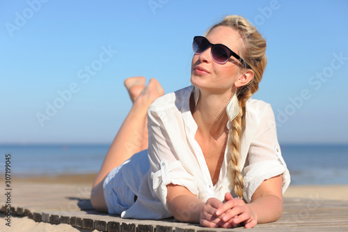 Girl in sunglasses on background of sky