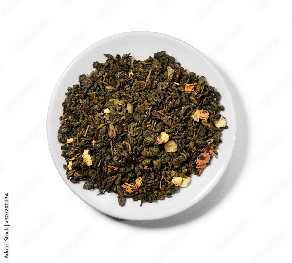 Green tea with aromatic additives. Top view on white background Green tea with aromatic additives. Top view on white background